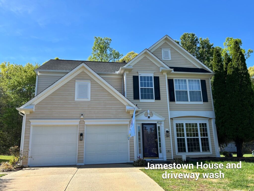 Clean vinyl siding and bright driveway after exterior cleaning in Jamestown