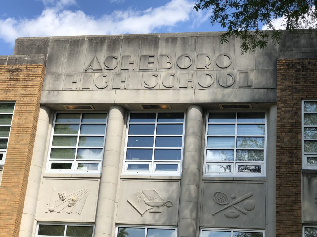 School entrance and concrete steps before exterior cleaning service in Asheboro NC