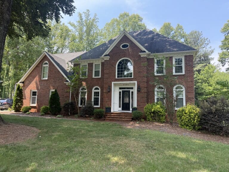 House softwashing in Oak Ridge NC removing algae and mildew from vinyl siding