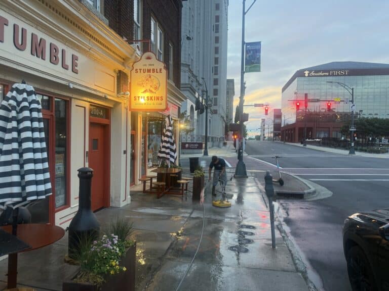 Paul Brothers Softwash cleaning a commercial walkway in Greensboro NC