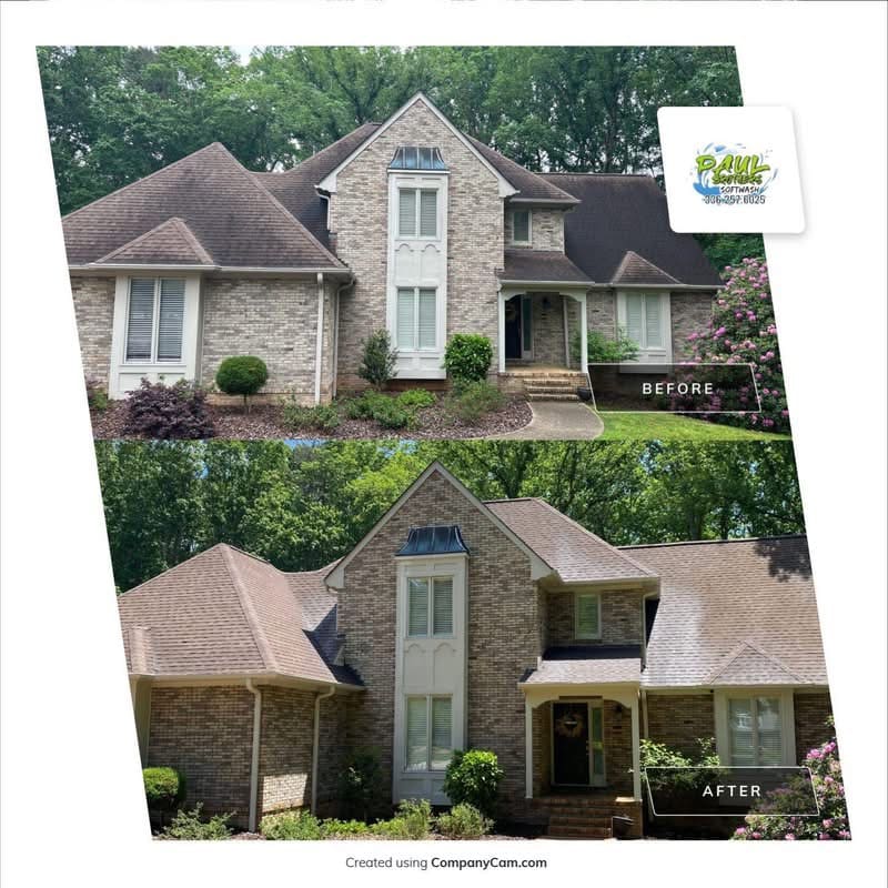 Technician performing roof cleaning on an asphalt shingle home in Oak Ridge NC using the softwashing method