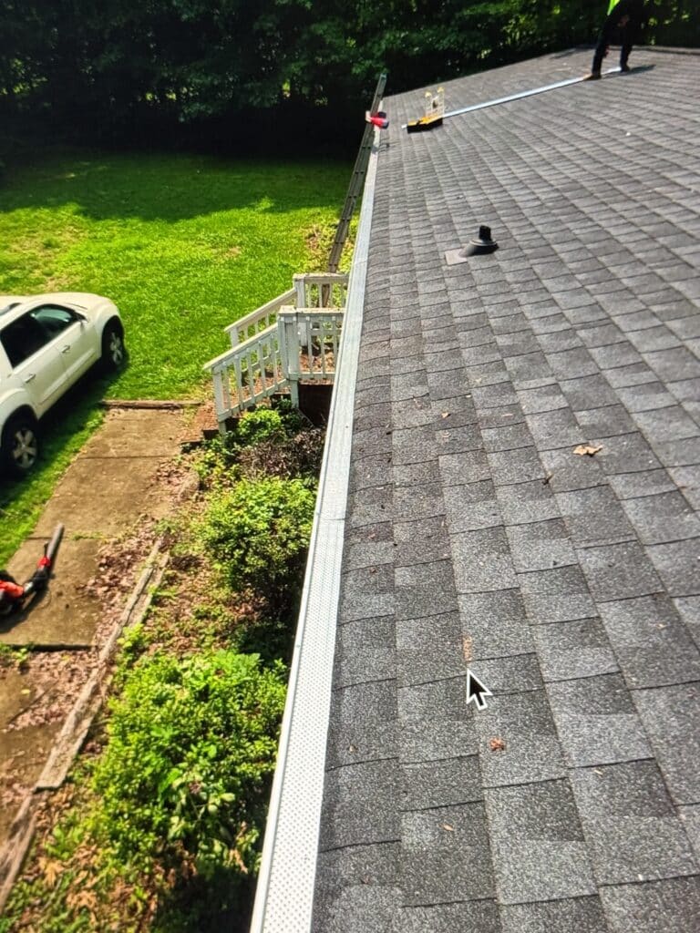 Professional gutter guard installation on a residential home in Asheboro, NC to help reduce gutter maintenance and improve water flow.